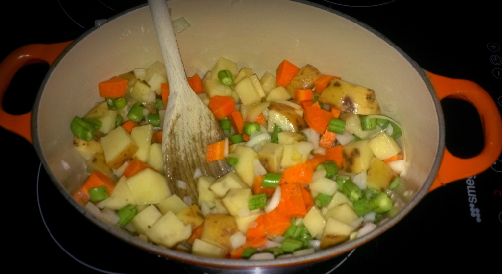 Cook the vegetables until softened. 