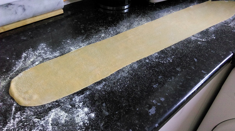 Lay the long strip on a counter dusted with semolina 