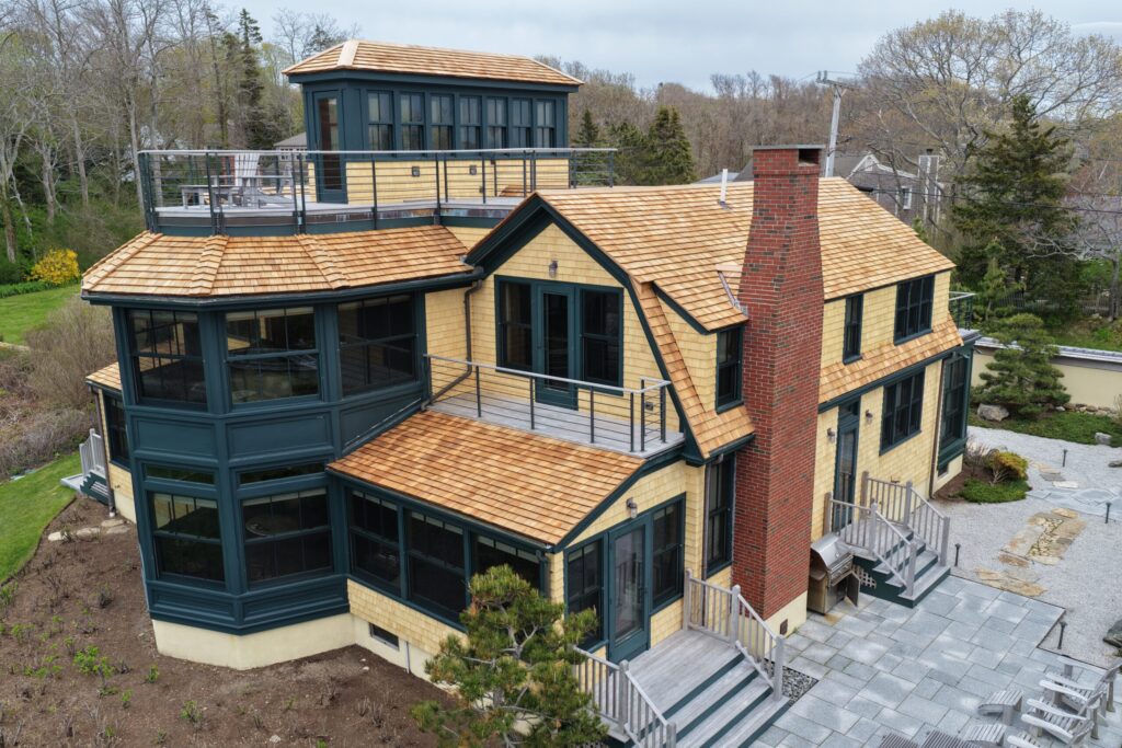 Woods Hole luxury home with red cedar roof and yellow cedar siding